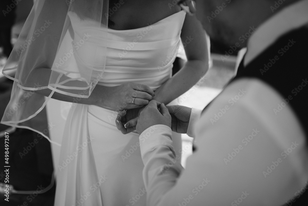 Naklejka premium Groom and bride walking. This day is the first of many beautiful days together.