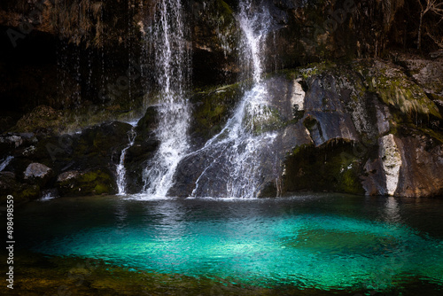 Fototapeta Naklejka Na Ścianę i Meble -  Alpine Waterfall with Green lagoon in Beautiful Autumn Season -  Waterfall Virje - Bovec, Slovenija