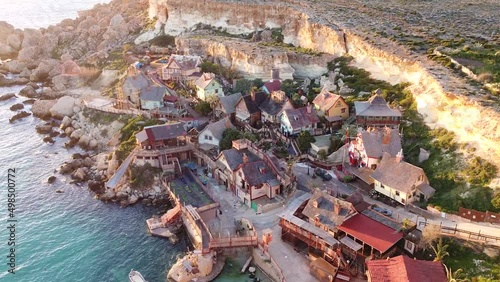 Wooden film set village of Popeye on Malta island coastline, aerial drone view photo