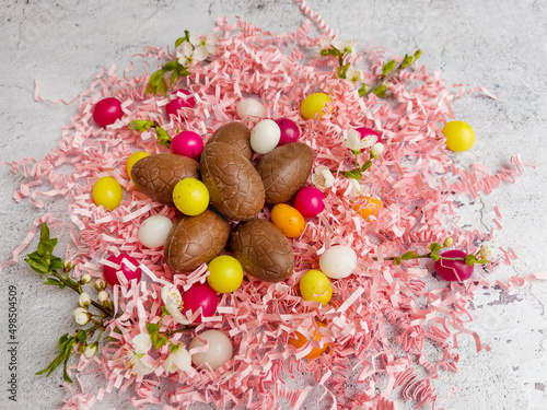 Chocolate Easter Eggs and Colorful Easter Candy  .Easter Greeting Card