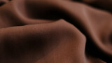 Brown silk fabric. Vintage French semi sheer crepe de chine fabric in a stunning lipstick Brown color. Texture background pattern. soft focus