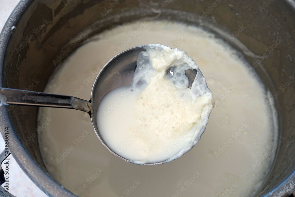 Fat milk cream on cooked milk, which is formed on natural cow's milk, Fat milk cream on cooked milk, which is formed on natural cow's milk,