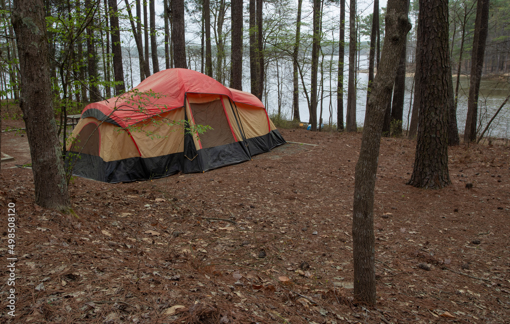 Two room tent near a large body of water