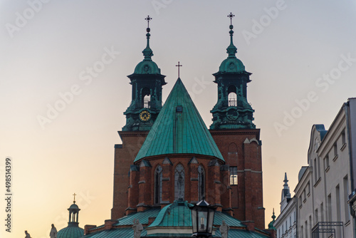 Obraz na płótnie Sunset. Church, cross. Architecture. Green roof. Brick walls. w salonie