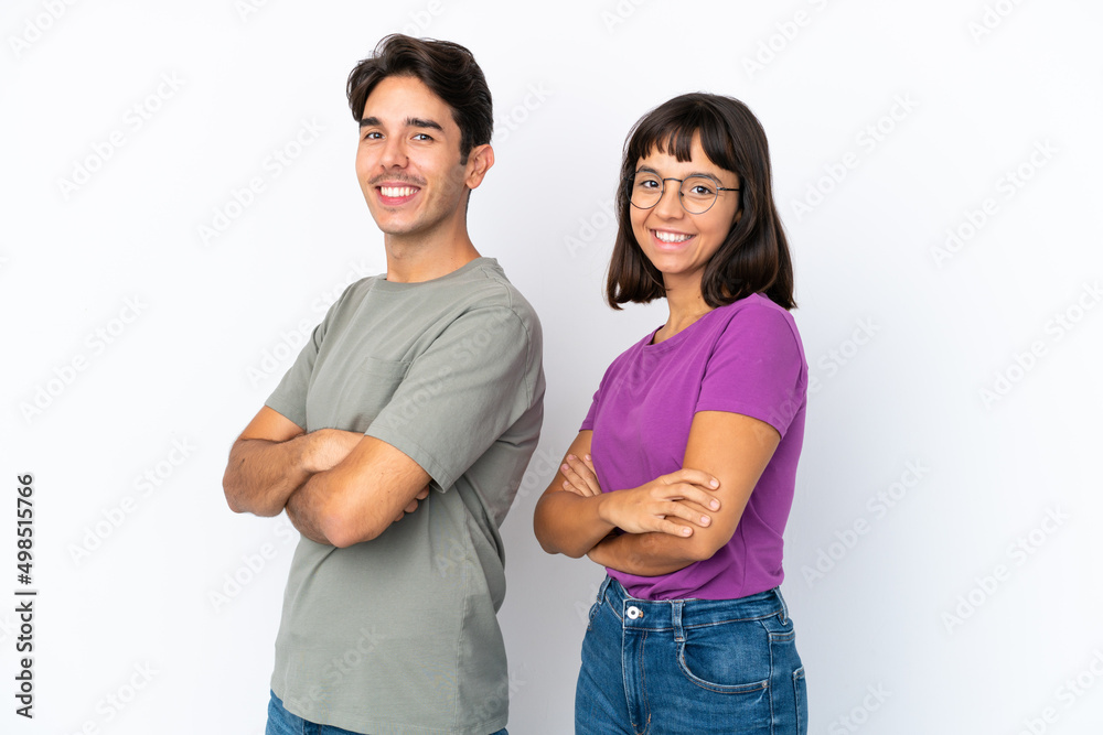 Young couple isolated on isolated white background keeping the arms crossed in lateral position while smiling Young couple isolated on isolated white background keeping the arms crossed in lateral position while smiling