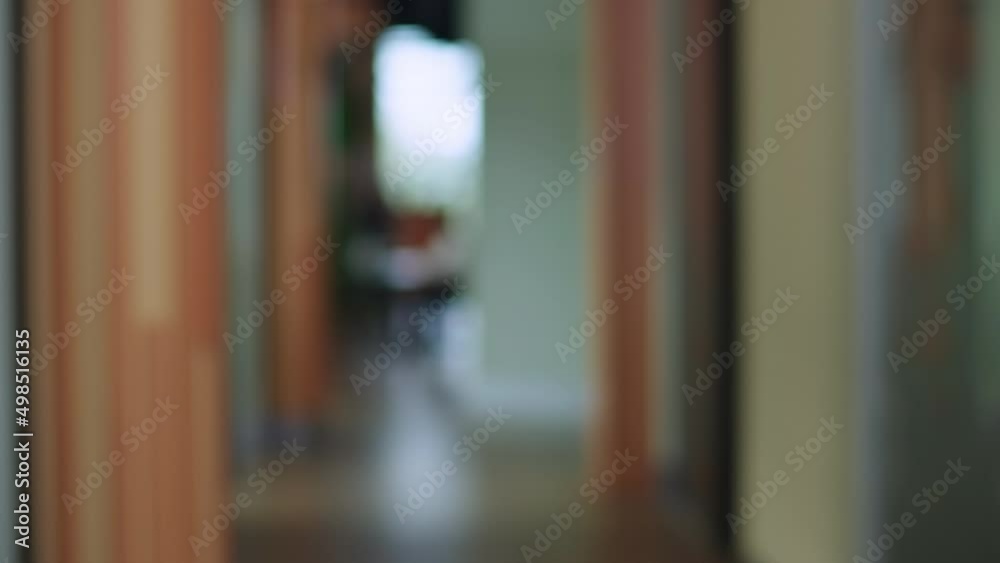 Wide shot office corridor with hurrying man running passing leaving. Unpunctual Caucasian male manager late for business meeting rushing indoors. Lifestyle and punctuality concept Wide shot office corridor with hurrying man running passing leaving. Unpunctual Caucasian male manager late for business meeting rushing indoors. Lifestyle and punctuality concept