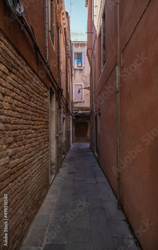 View of historic houses in narrow alley in Venice  Italy