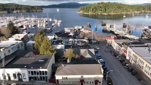 Cinematic 4K aerial drone footage of Spring Street and Front Street in the Port and town of Friday Harbor with the ferry terminal, commercial zone, downriggers in the San Juan Islands photo