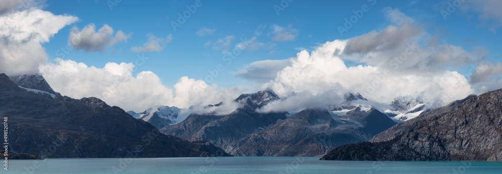 Rugged Mountain Landscape on Pacific Ocean Coast. Cloudy morning Sky Art Render. Background Nature Image from Glacier Bay National Park, Alaska, USA.