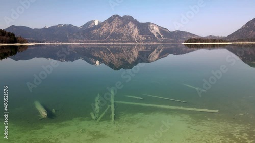 Aerial drone of Lake Walchen, Walchensee in Bavaria Germany, with Herzogstand mountain in spring in 4k, HD und UHD