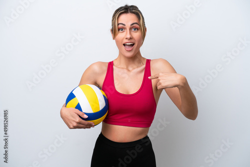 Young caucasian woman playing volleyball isolated on white background with surprise facial expression