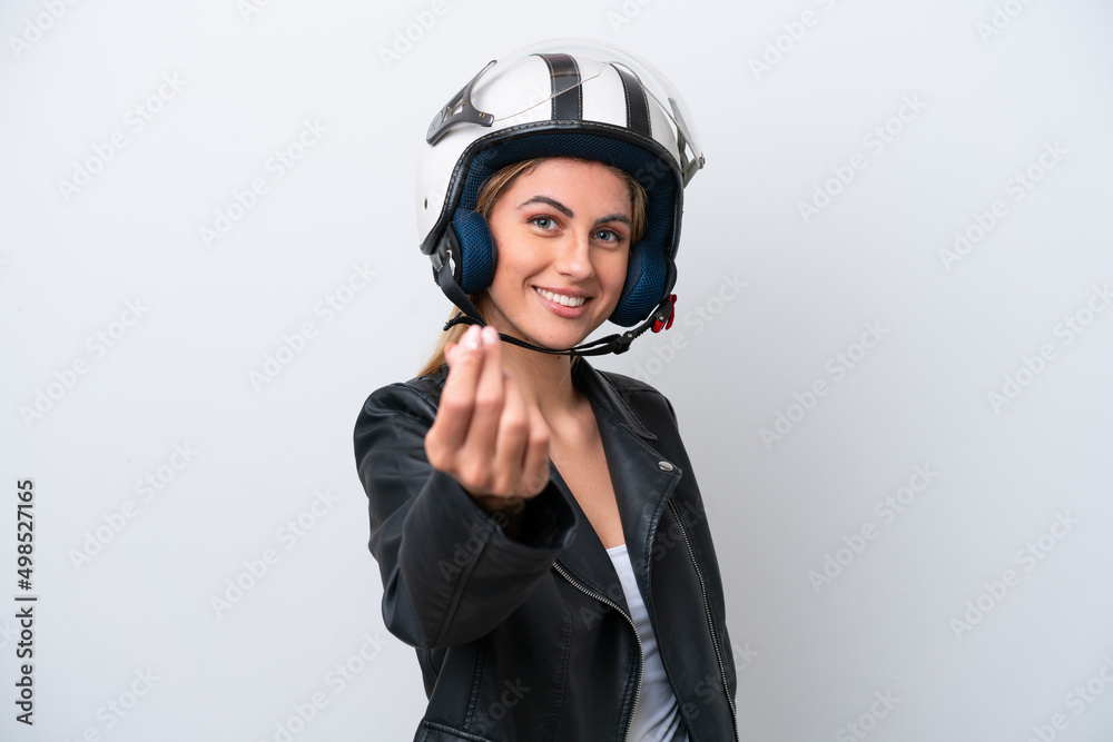 Young caucasian woman with a motorcycle helmet isolated on white background making money gesture Young caucasian woman with a motorcycle helmet isolated on white background making money gesture