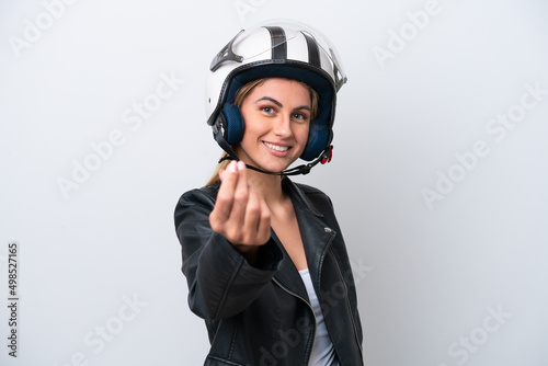 Young caucasian woman with a motorcycle helmet isolated on white background making money gesture