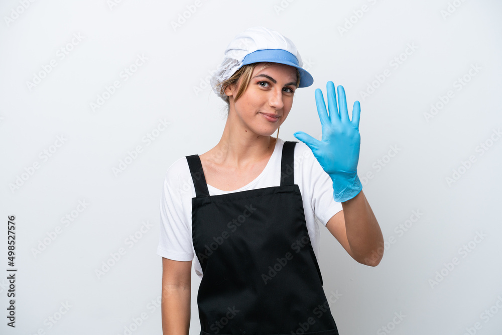 Fishwife woman isolated on white background counting five with fingers Fishwife woman isolated on white background counting five with fingers
