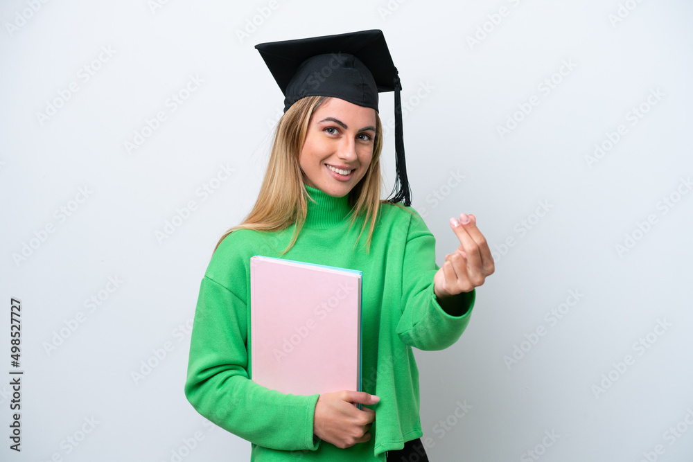 Young university graduate woman isolated on white background making money gesture Young university graduate woman isolated on white background making money gesture