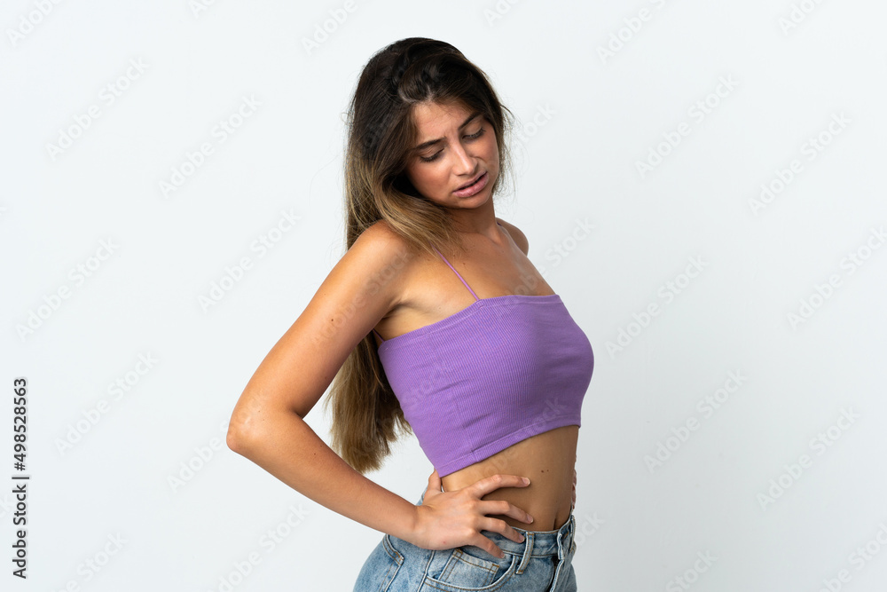 Young caucasian woman isolated  on white background suffering from backache for having made an effort