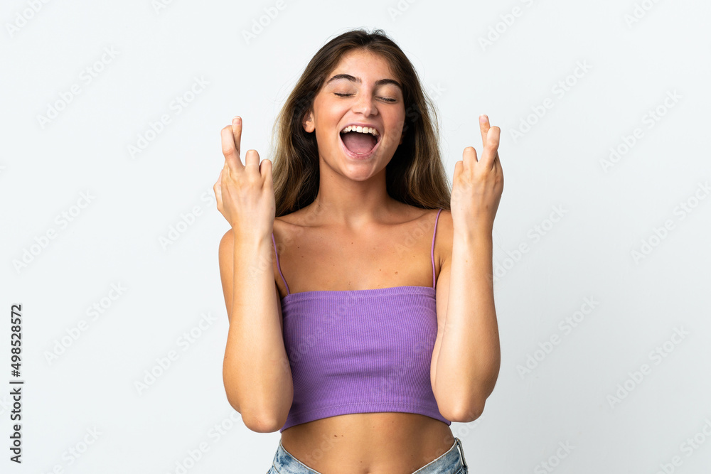 Young caucasian woman isolated on white background with fingers crossing Young caucasian woman isolated on white background with fingers crossing