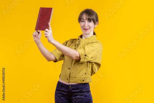 Woman shows book. Girl with...