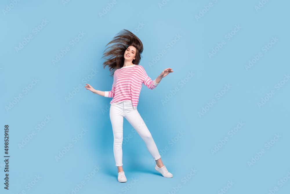 Full length photo of gorgeous satisfied lady enjoy weekend disco clubbing isolated on blue color background Full length photo of gorgeous satisfied lady enjoy weekend disco clubbing isolated on blue color background