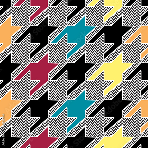 Colorful houndstooth pattern on chevron background. Trendy fabric swatch design.