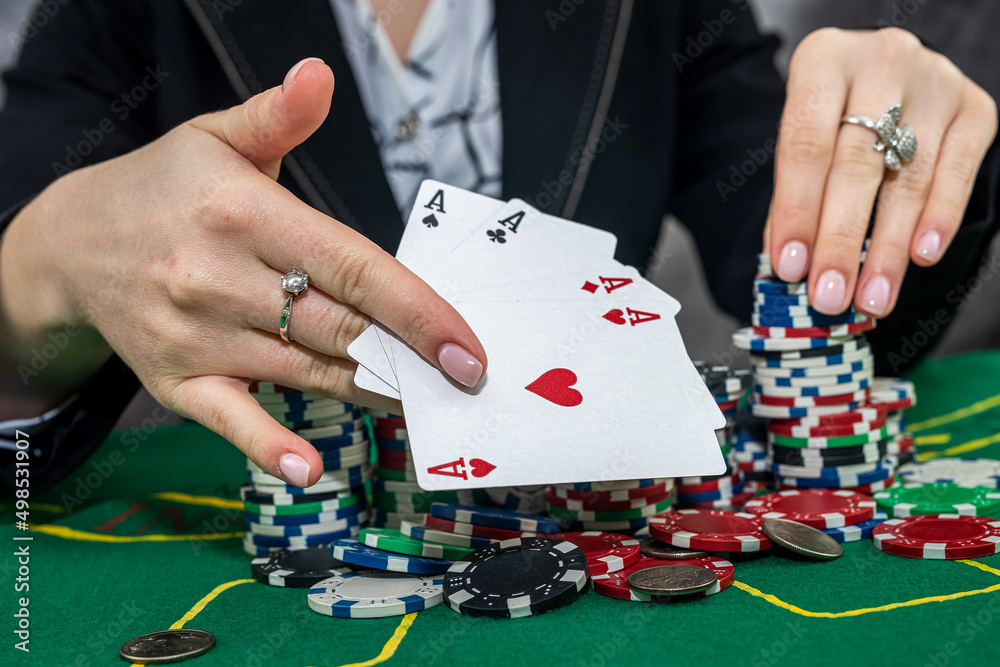 young woman wear black suit playing poker in casino young woman wear black suit playing poker in casino