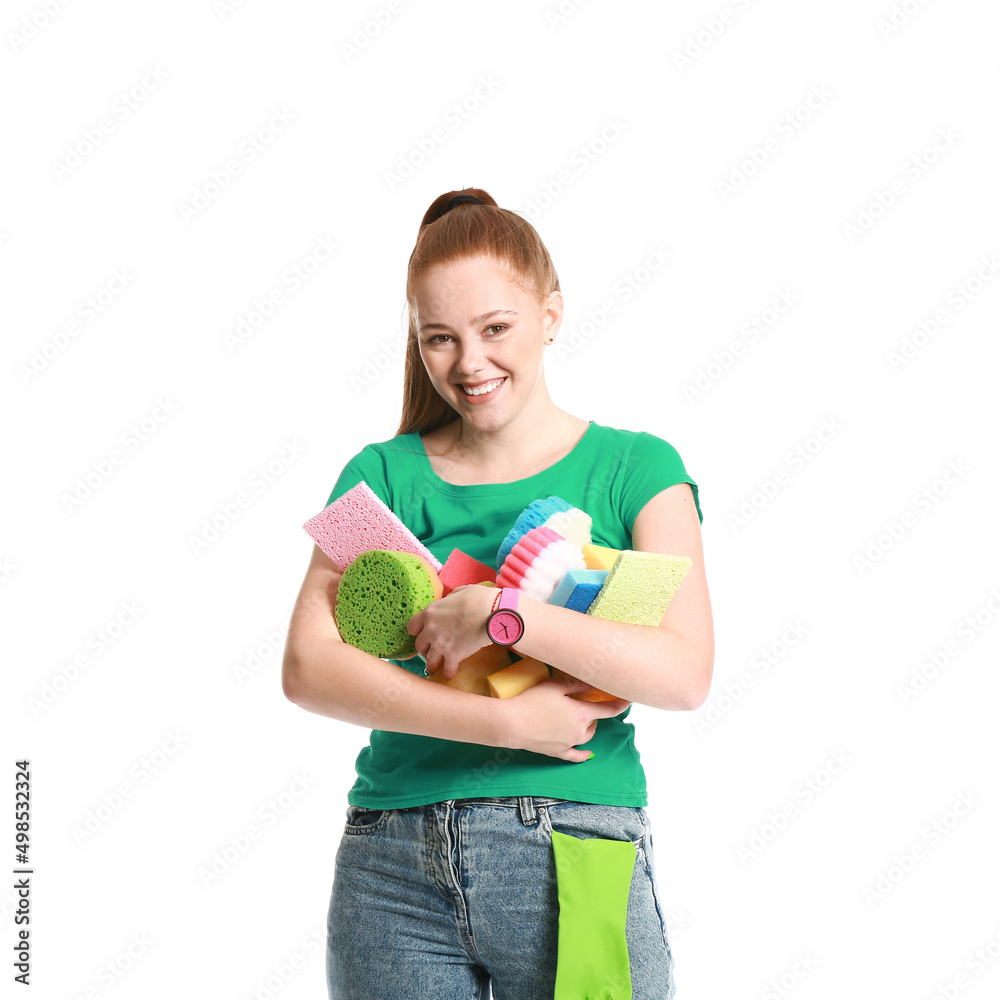 Young woman with many sponges on white background Young woman with many sponges on white background
