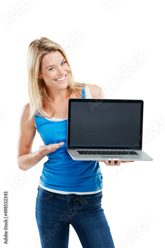 Everything you need is just a click away. Shot of a young woman holding a laptop against a white background.
