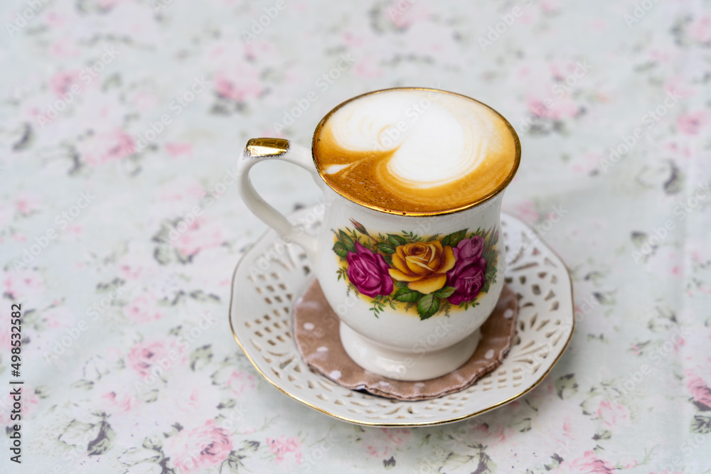 Fototapeta premium Vintage coffee cup on vintage table