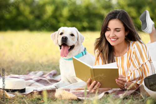 Woman with cute Labrador re...
