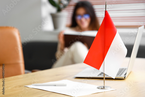 Flag of Indonesia on table in office, closeup