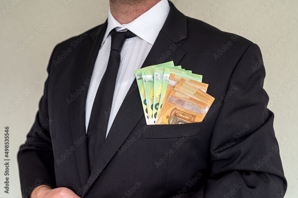 Business man wearing suit giving euro banknotes to subordinate office. Business man wearing suit giving euro banknotes to subordinate office.