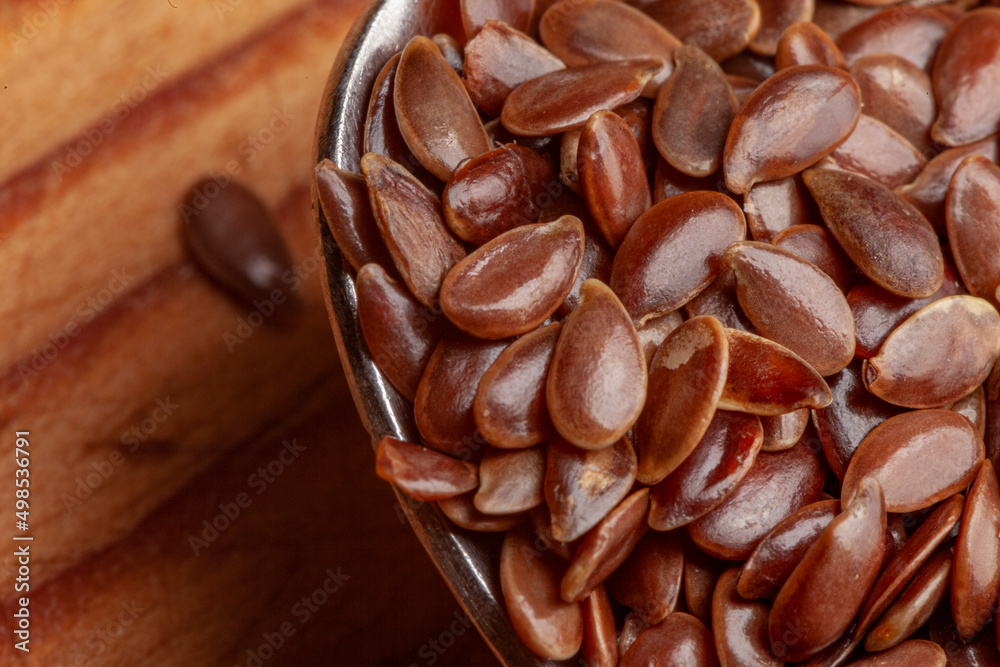 Overhead extreme close up on spoon full of flax seed Overhead extreme close up on spoon full of flax seed