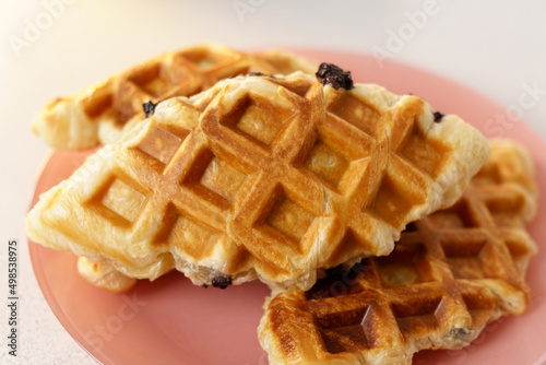 Croffle or waffle dessert. Fresh baked croffle. closeup. Selective focus