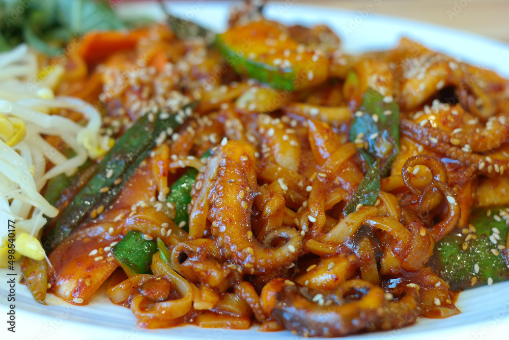 Octopus cut into pieces and stir-fried in a spicy sauce made of red chili powder and minced garlic. Octopus cut into pieces and stir-fried in a spicy sauce made of red chili powder and minced garlic.
