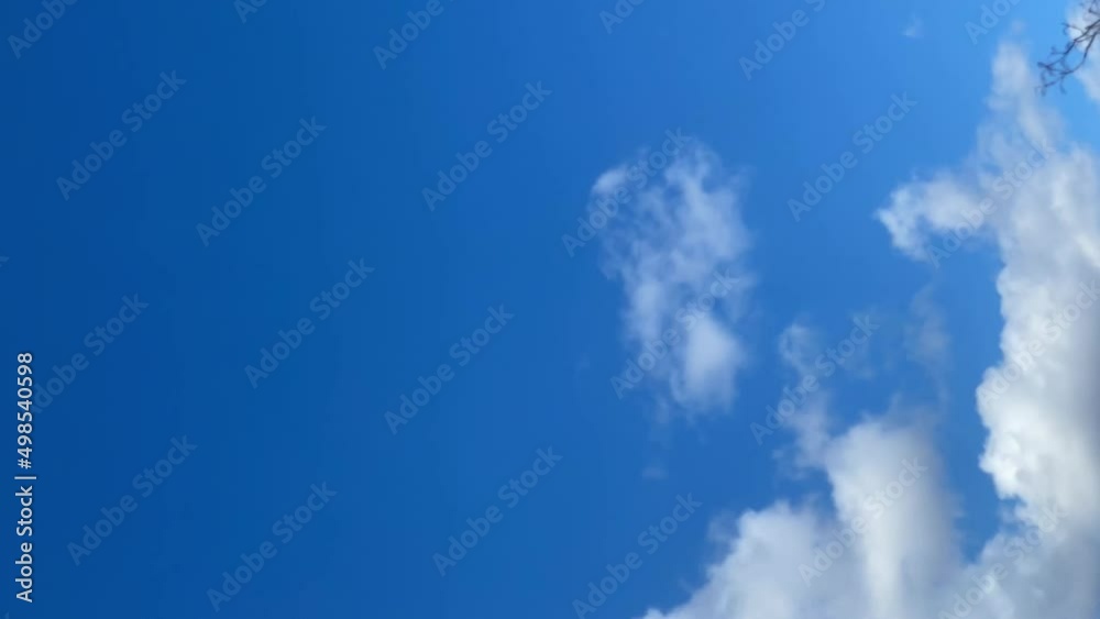 Time lapse of moving white clouds in blue sky. Time lapse of moving white clouds in blue sky.
