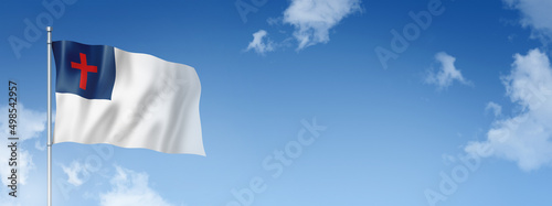 Photography Christian flag isolated on a blue sky. Horizontal banner