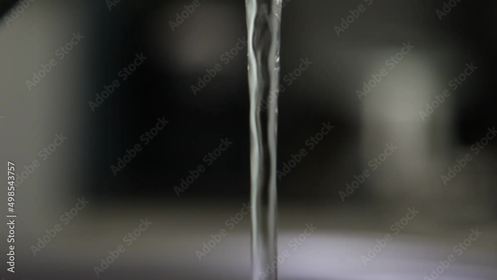Closeup view of faucet running tap water, running water from sink tap, cleaning concept