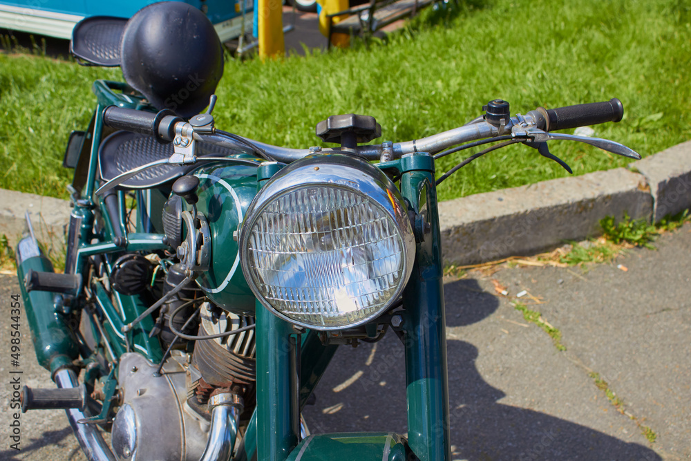 Fototapeta premium old motorcycle,Close up shot of a vintage motorcycle headlight and horn.