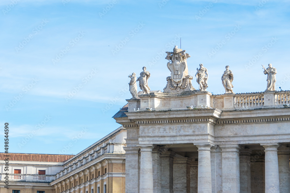 Obraz premium Bernini's Saints Statues at top of St. Peter's Square Colonnade, Vatican, Italy