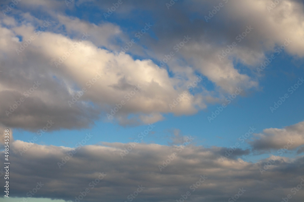 blue clear sky with lots of white fluffy clouds blue clear sky with lots of white fluffy clouds