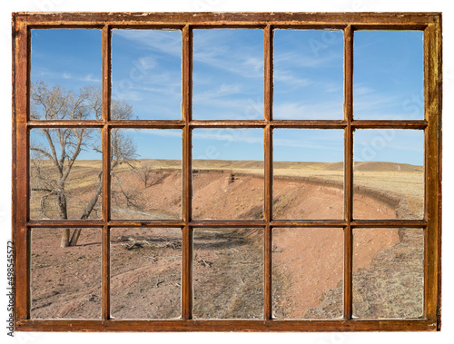 early spring on a prairie in northern Colorado as seen from a vintage sash window