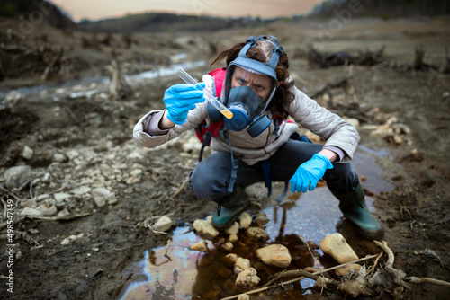 Biologist Taking Samples of Soil and Water than Examining them for Toxicology on Location © Fotopogledi