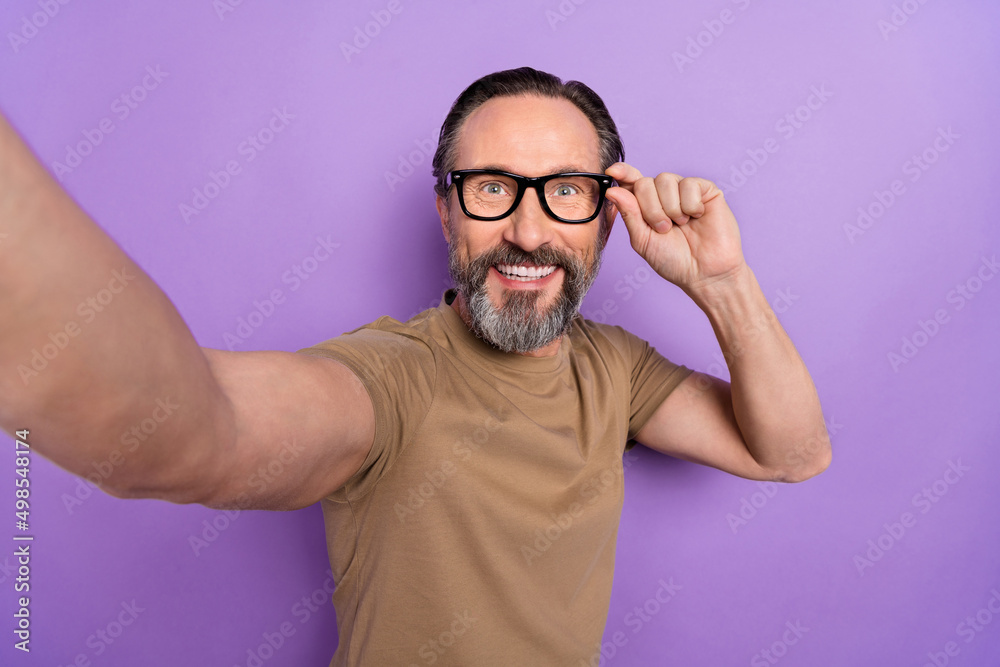 Portrait of cheerful handsome businessman take selfie travel around the globe make video vlog isolated on violet color background Portrait of cheerful handsome businessman take selfie travel around the globe make video vlog isolated on violet color background