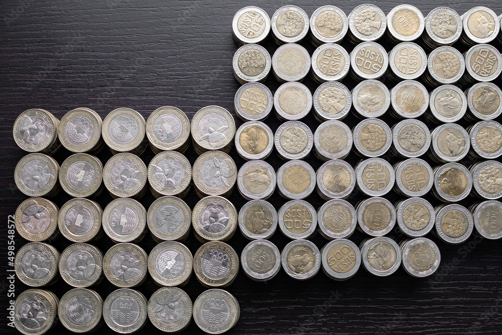 Pile of Colombian coins of 500 and 1000 denominations over wooden background. Ideal for economy, money, banks, save money and finance.
Pile of Colombian coins of 500 and 1000 denominations over wooden background. Ideal for economy, money, banks, save money and finance.