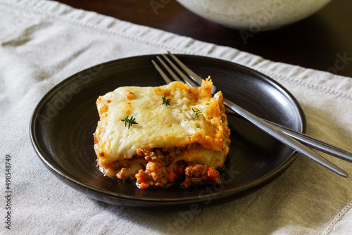 Homemade lasagne with bolognese sauce and bechamel. Italian cuisine.