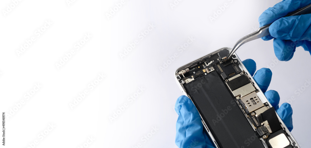 Foto Stock Technician repairing the Cell phone parts and tools for recovery  repair phone smartphone and upgrade mobile technology,the concept of  computer hardware inside. | Adobe Stock