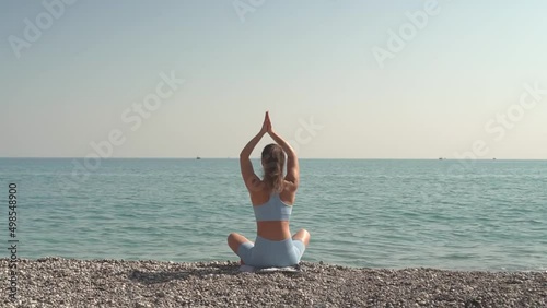 Practicing Yoga By The Sea.