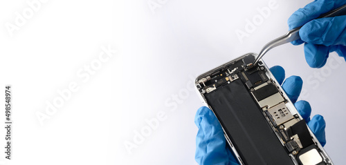 Photography Technician repairing the Cell phone parts and tools for recovery repair phone smartphone and upgrade mobile technology,the concept of computer hardware inside