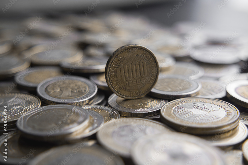 Stacks of Colombian coins of 500 and 1000 pesos denominations, money devaluation
Stacks of Colombian coins of 500 and 1000 pesos denominations, money devaluation