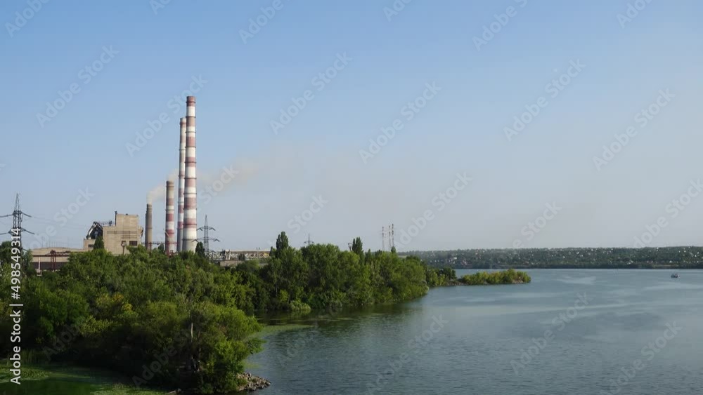 power plant on a river bank power plant on a river bank
